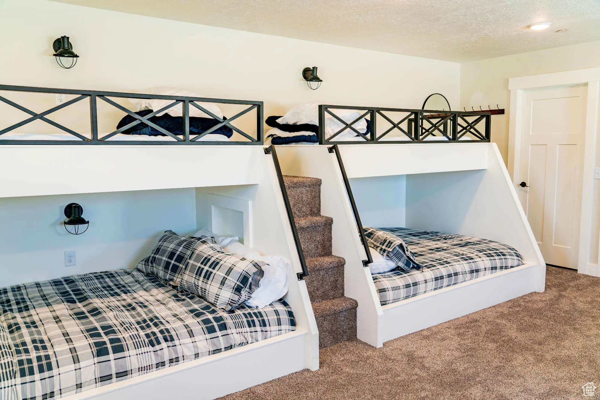 Carpeted bedroom with a textured ceiling