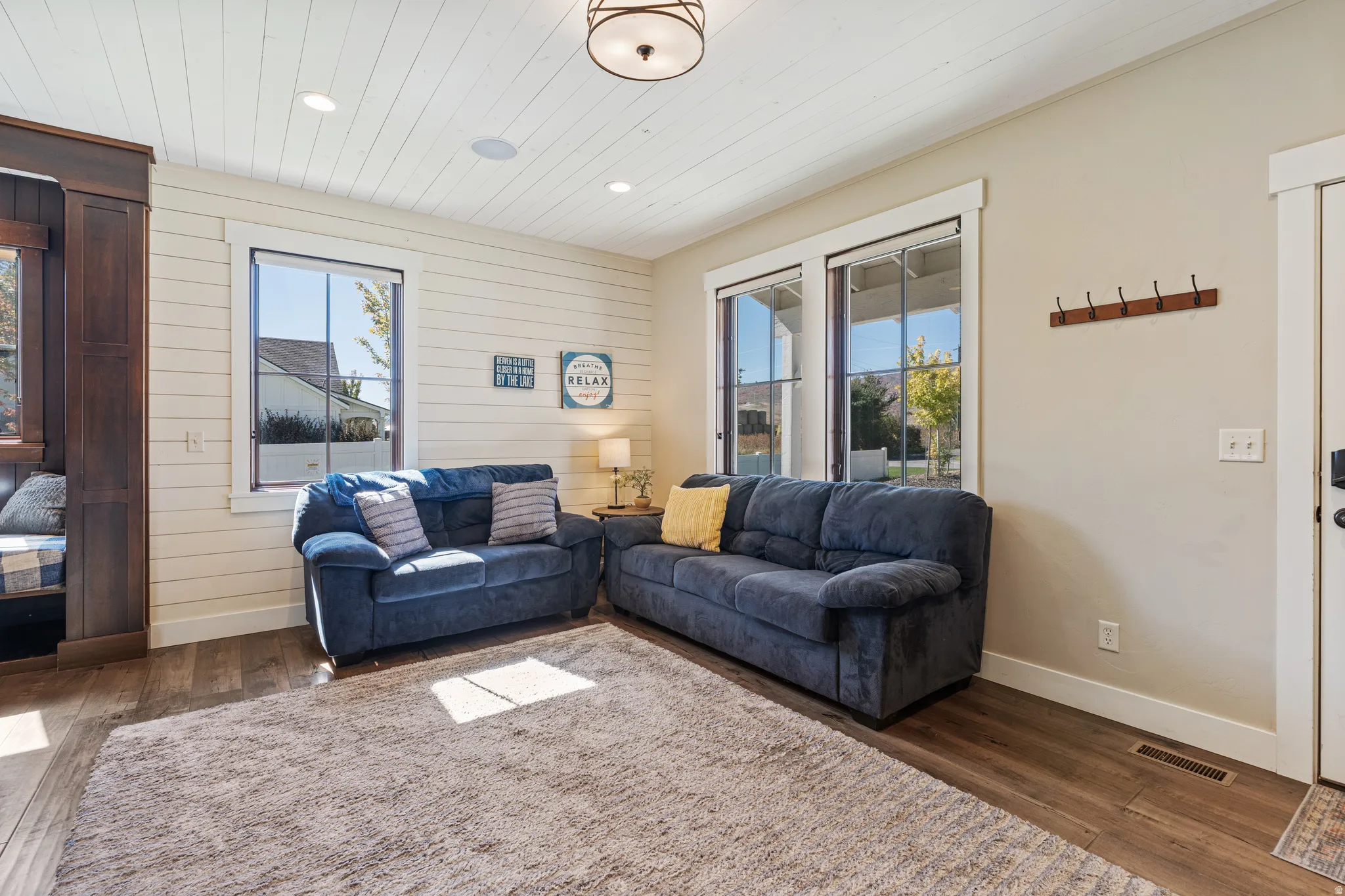 Wood-finish flooring, recessed ceiling lighting, and a built-in window bench