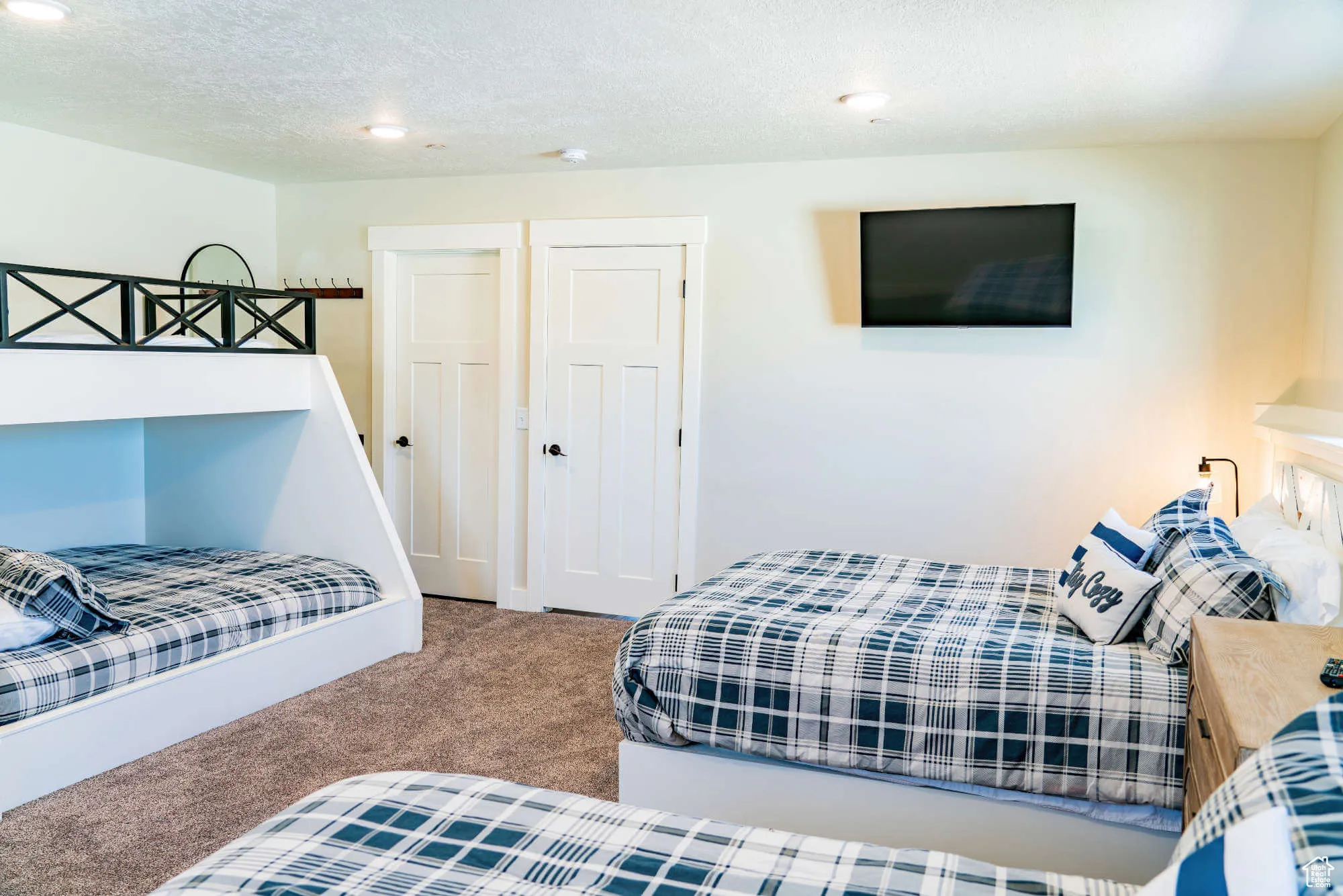 Bedroom with carpet flooring, recessed lighting, and a textured ceiling