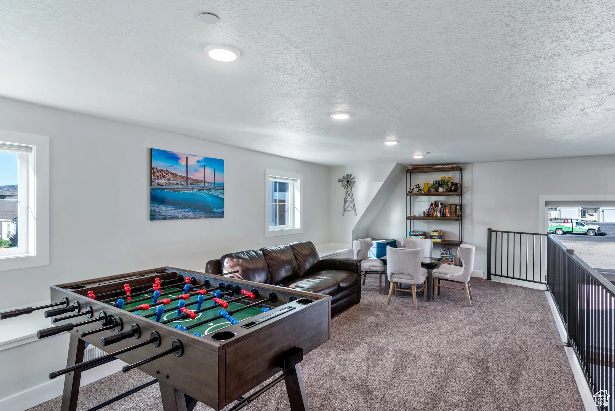 Rec room featuring carpet, a textured ceiling, and recessed lighting