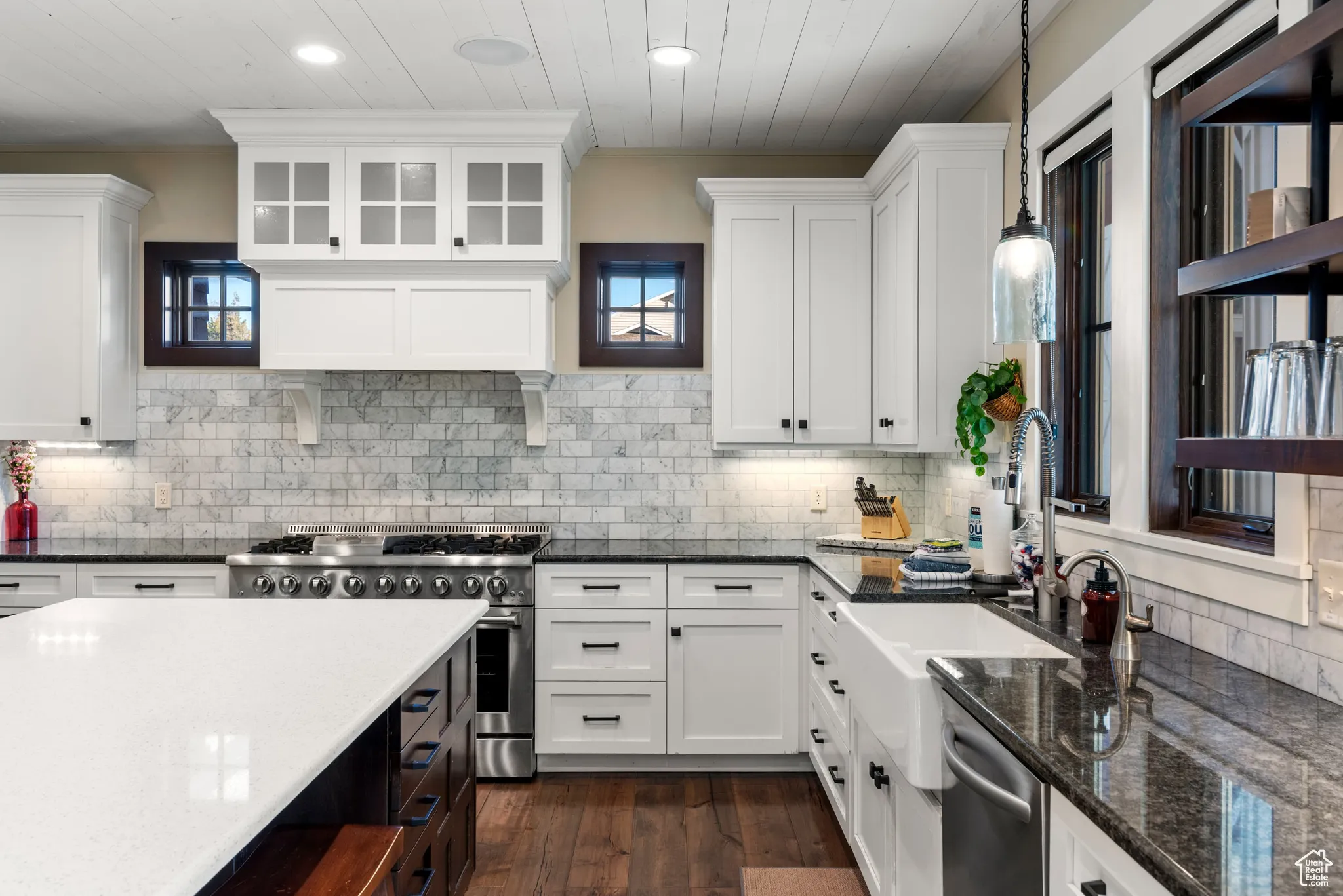 Kitchen featuring appliances with stainless steel finishes, white cabinets, recessed lighting, and wooden ceiling