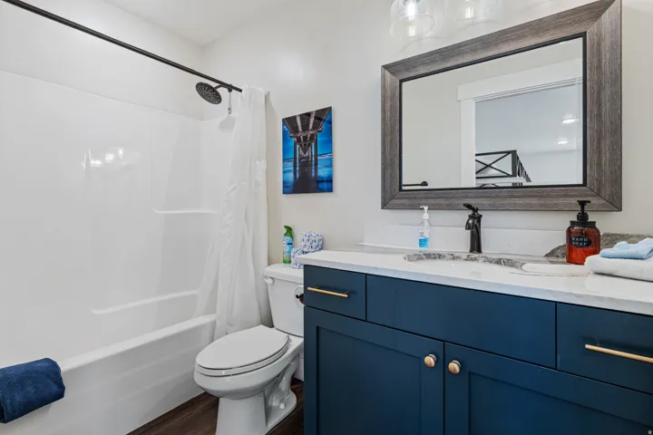 White shower-tub combination with matte black fixtures
