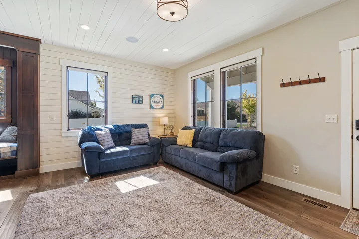 Wood-finish flooring, recessed ceiling lighting, and a built-in window bench