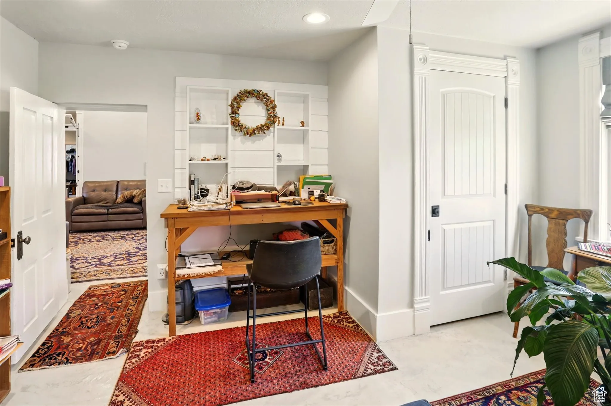 Office space with recessed lighting and baseboards