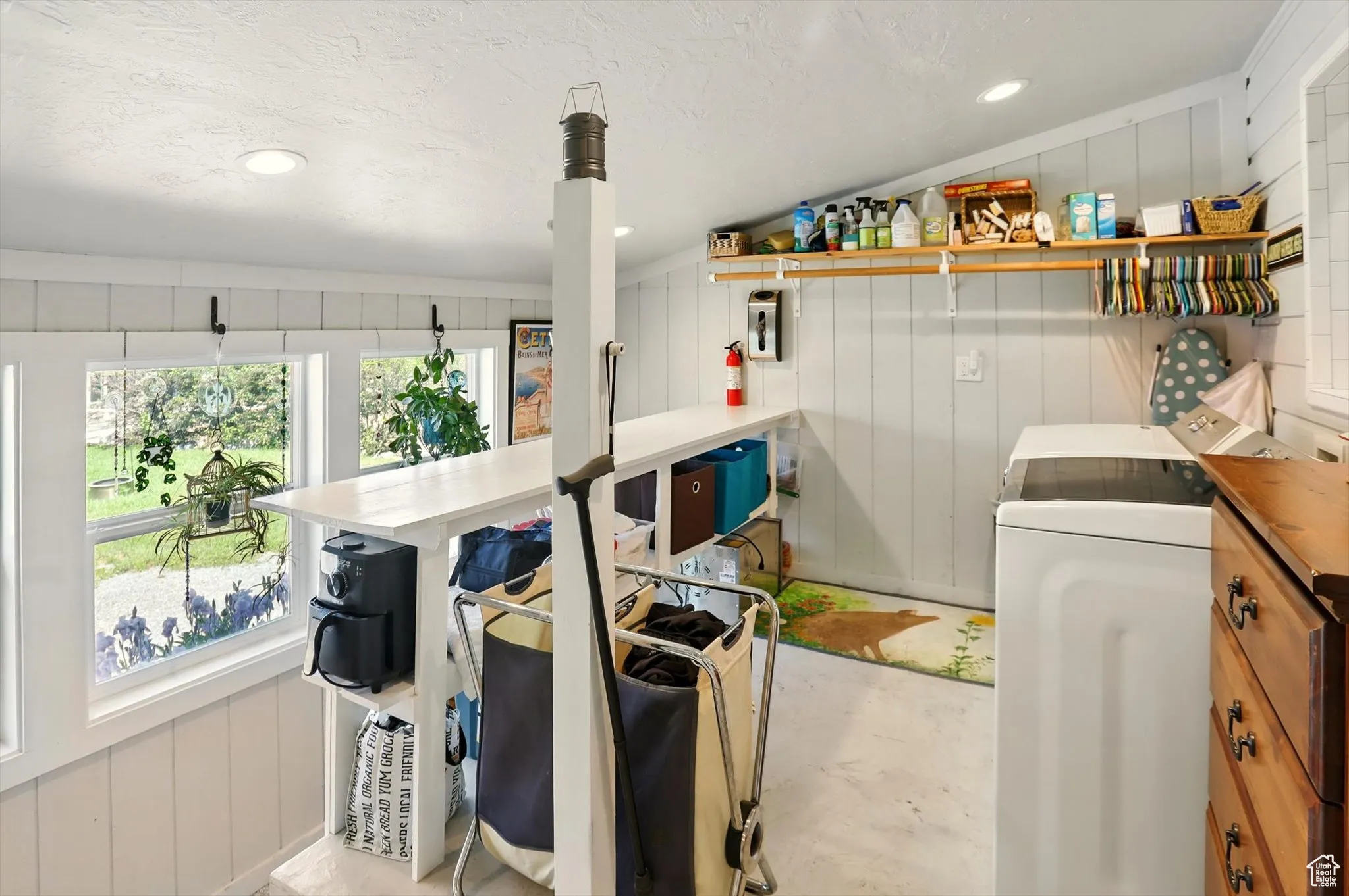 Laundry room with washer / dryer and a decorative wall