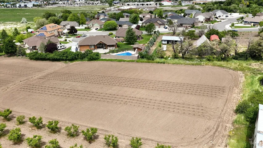 Aerial perspective of suburban area featuring a pool area