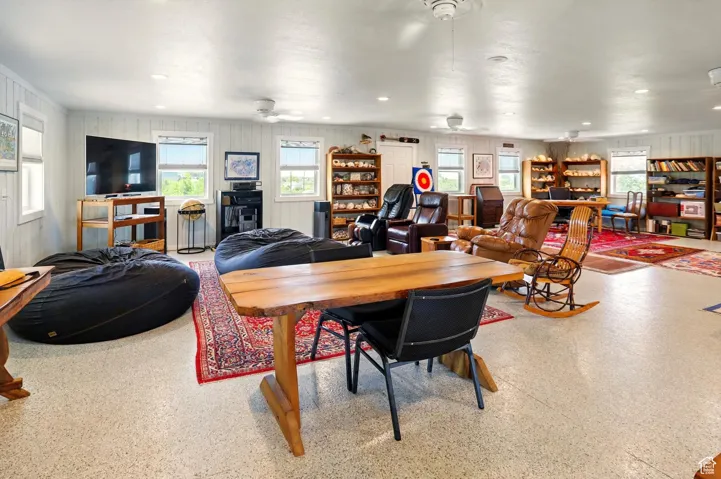 Dining space featuring a ceiling fan and recessed lighting