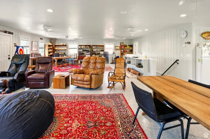 Living room with ceiling fan and recessed lighting