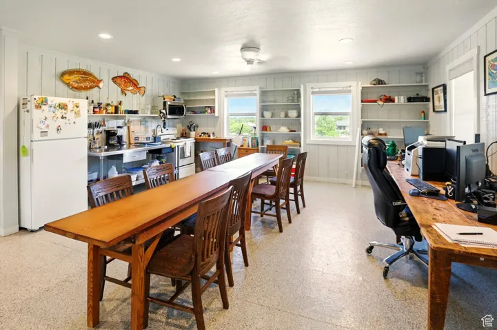 Dining area featuring a desk, baseboards, recessed lighting, and ceiling fan