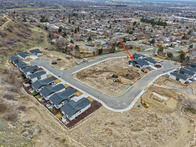 Aerial view of property's location with nearby suburban area