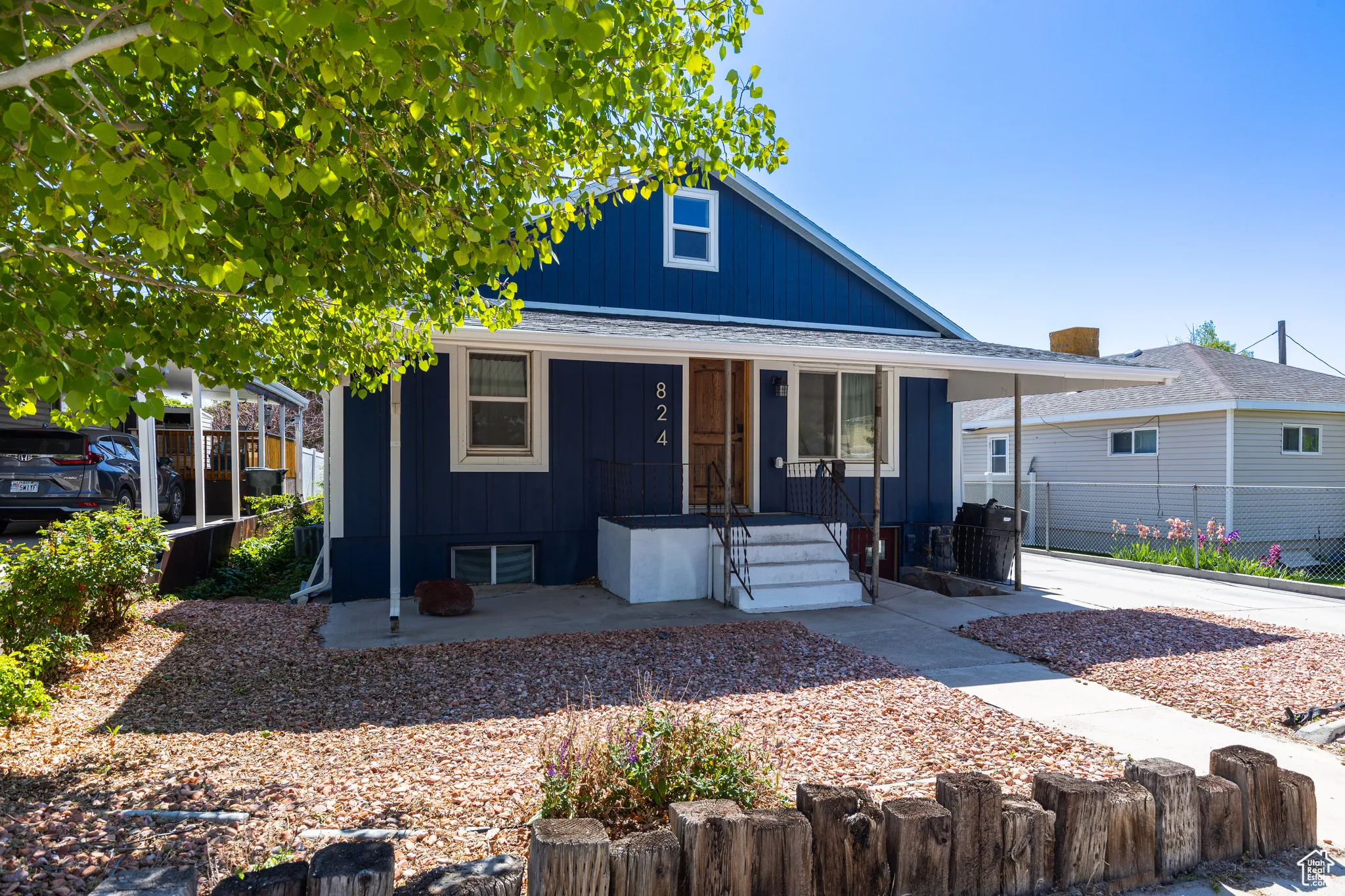 Bungalow-style house with a porch and board and batten siding
