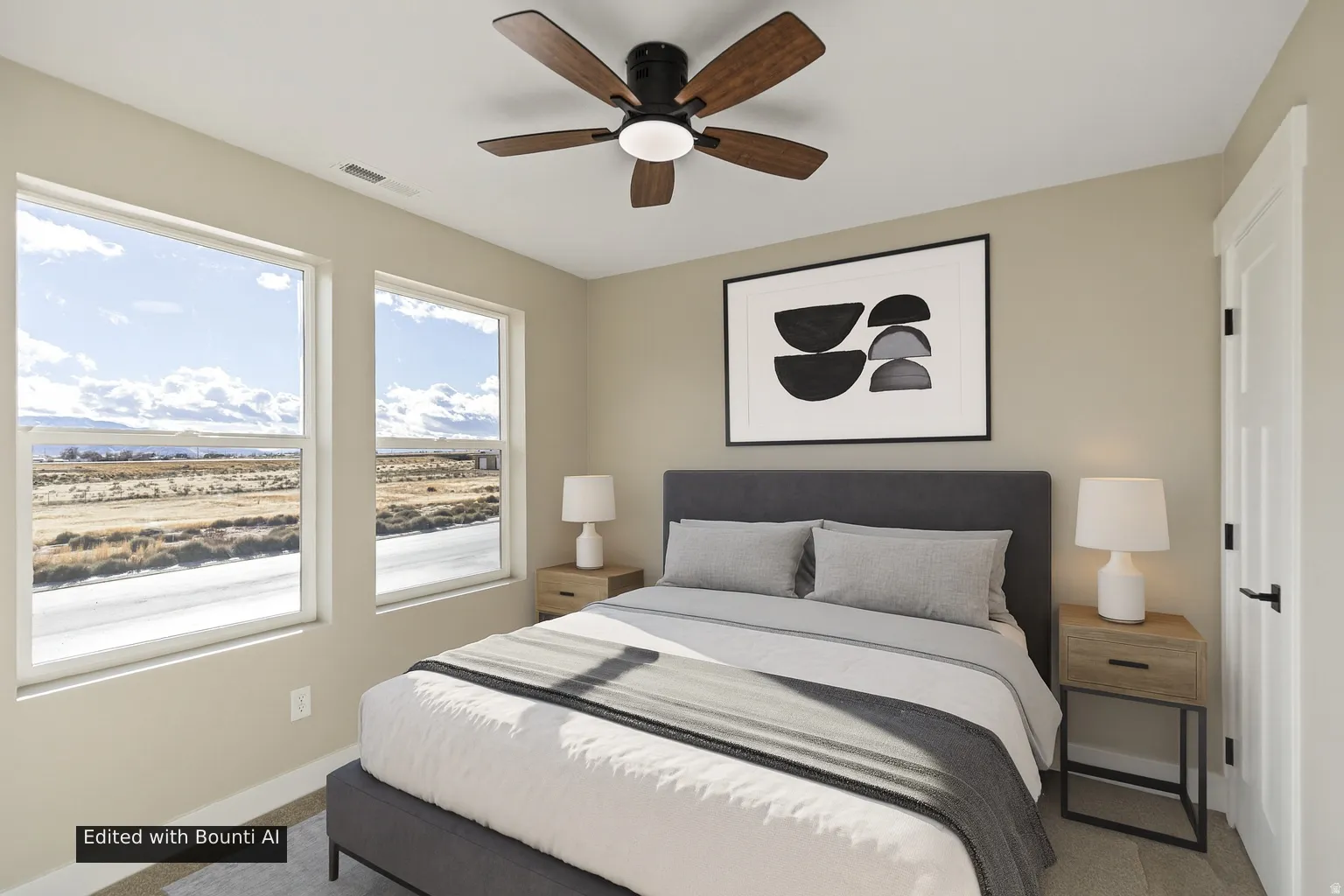 Bedroom featuring a ceiling fan and carpet