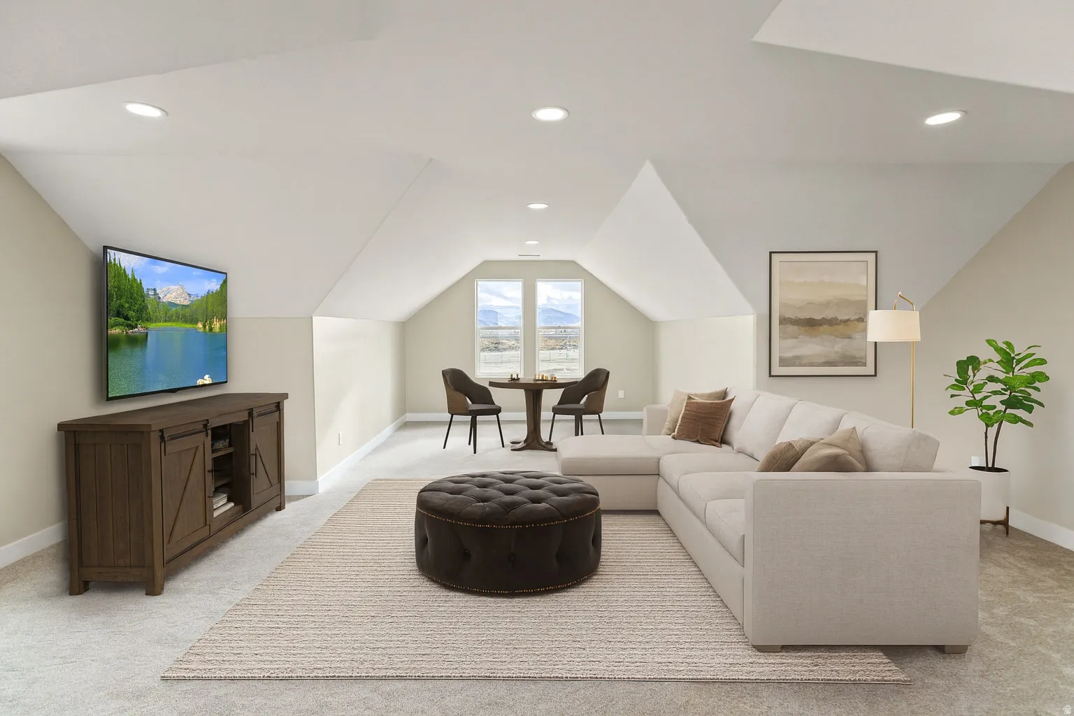 Living area with light carpet, vaulted ceiling, and recessed lighting
