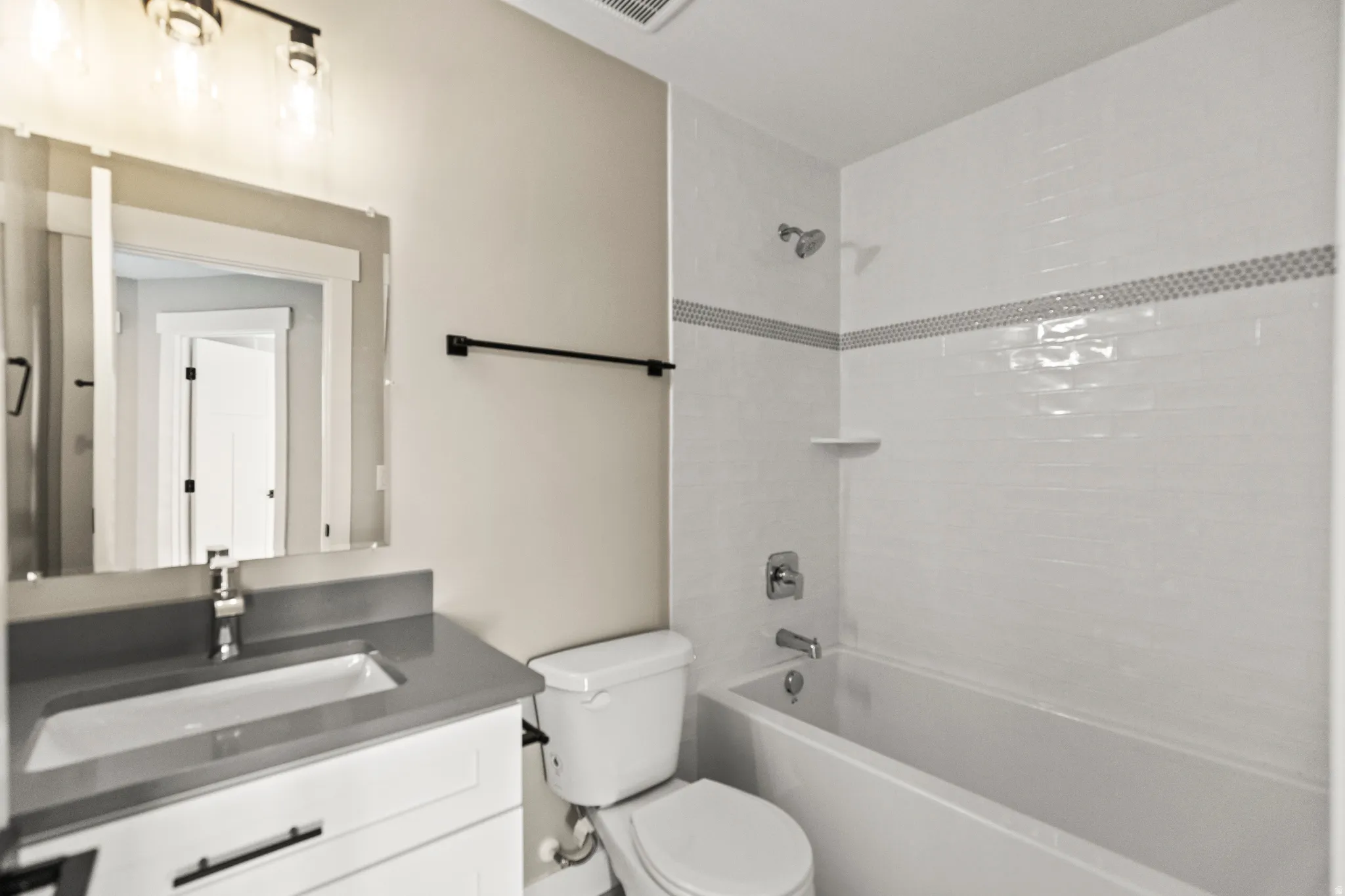 Bathroom with vanity and shower / bathtub combination