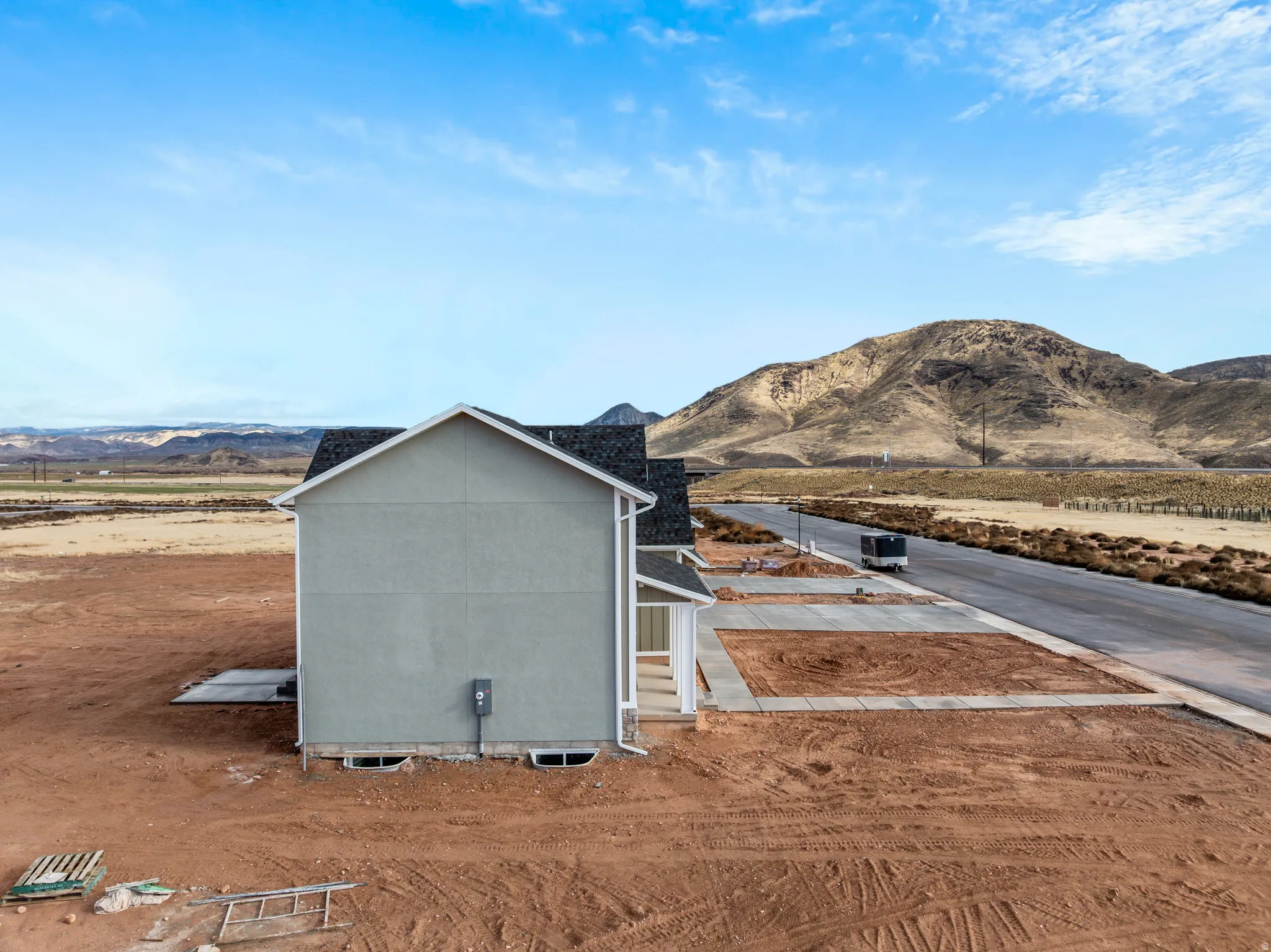 View of side of home featuring a mountain view