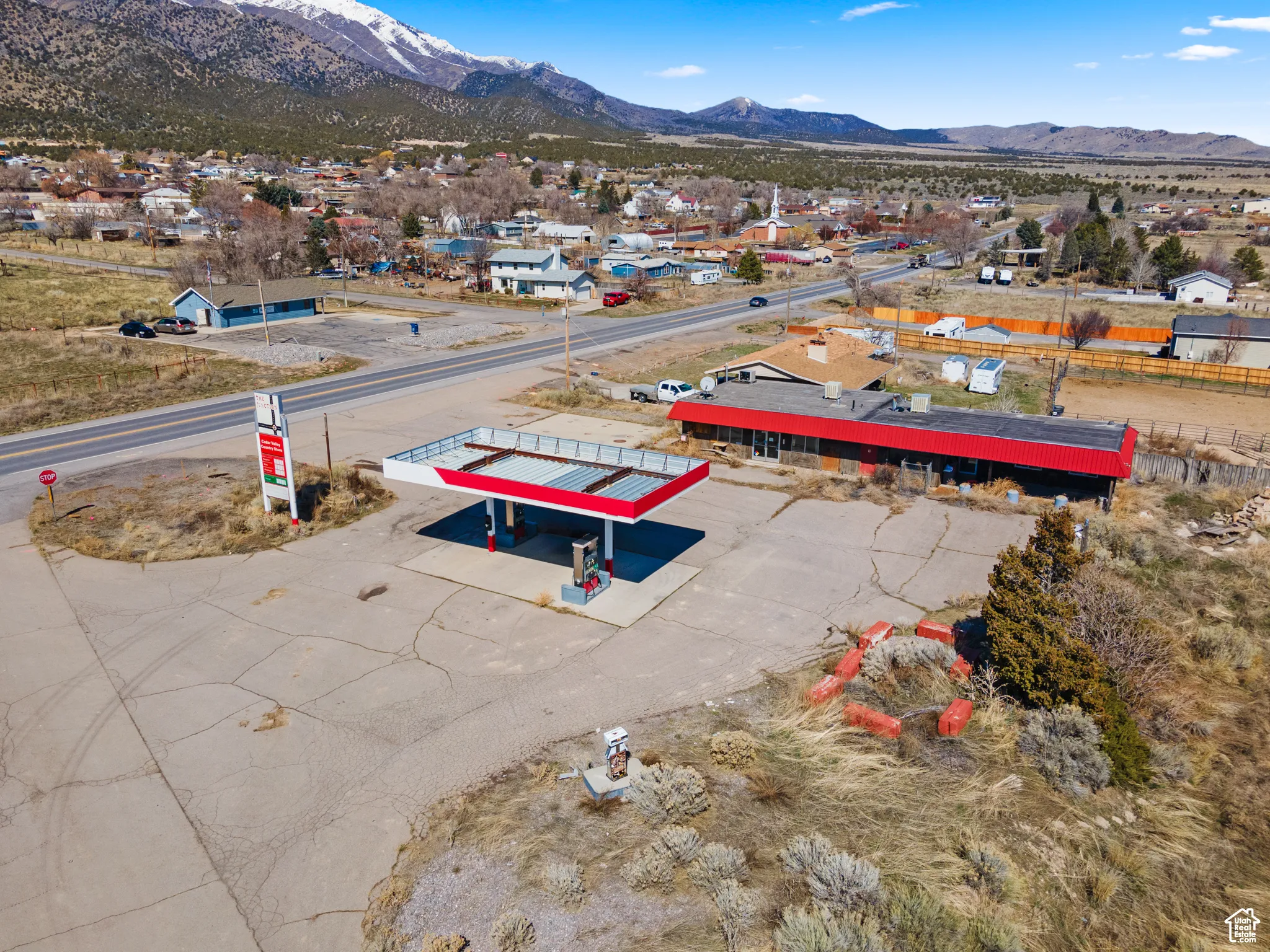 Aerial perspective of suburban area with a mountainous background