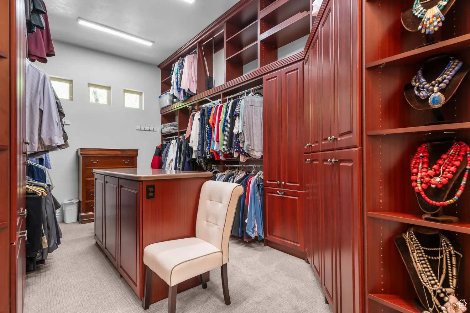 Walk in closet featuring light carpet