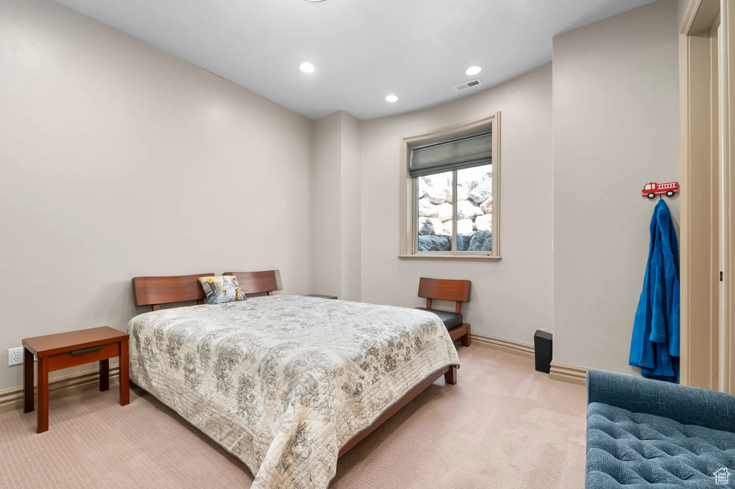 Carpeted bedroom with recessed lighting and baseboards