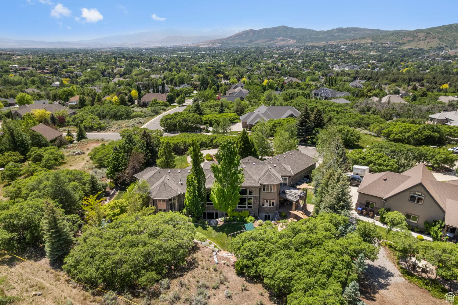 Aerial view of residential area with a mountainous background