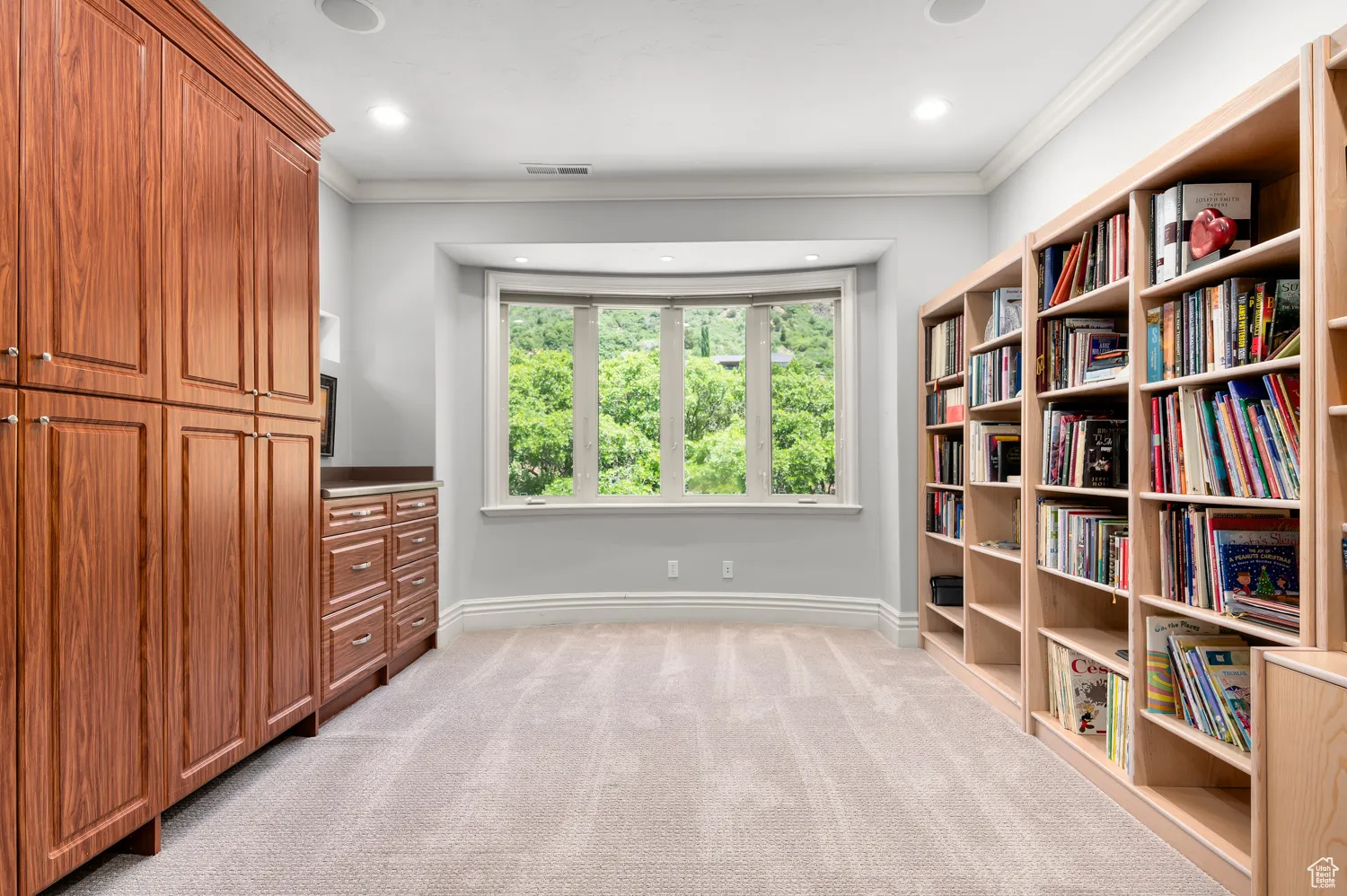 Unfurnished room featuring ornamental molding, baseboards, light carpet, and recessed lighting