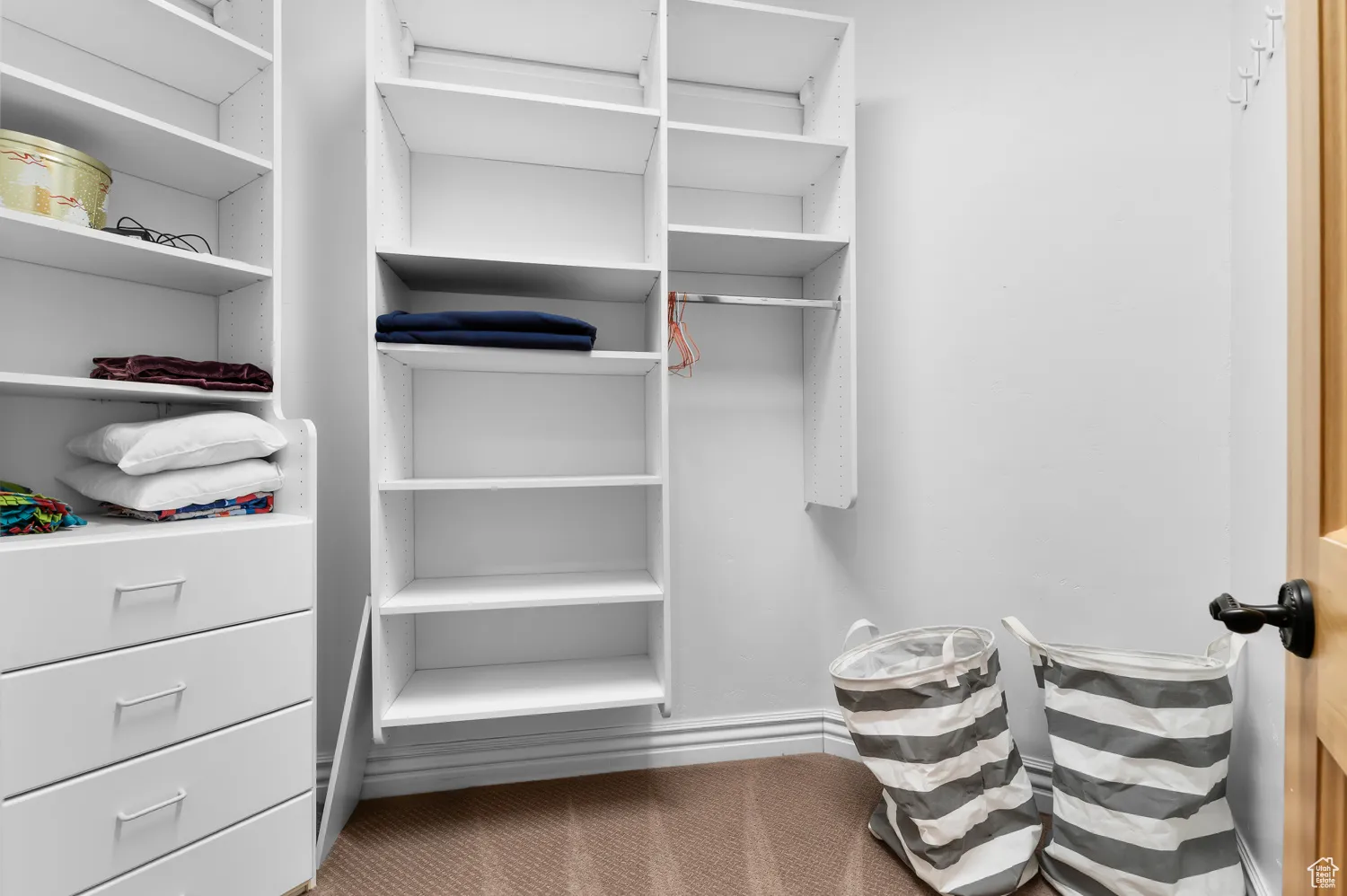 Spacious closet with carpet floors