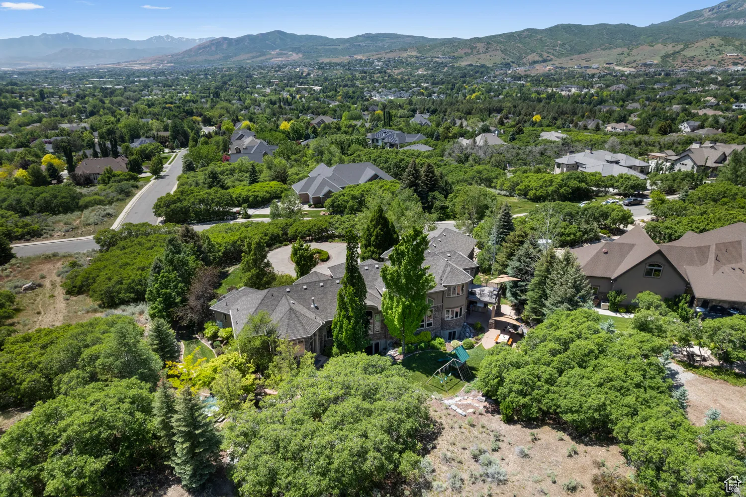 Aerial view of residential area featuring a mountain backdrop