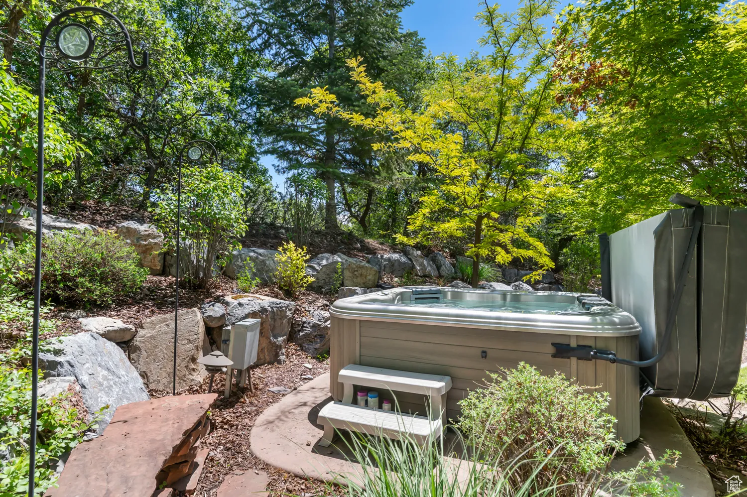 View of yard with a hot tub