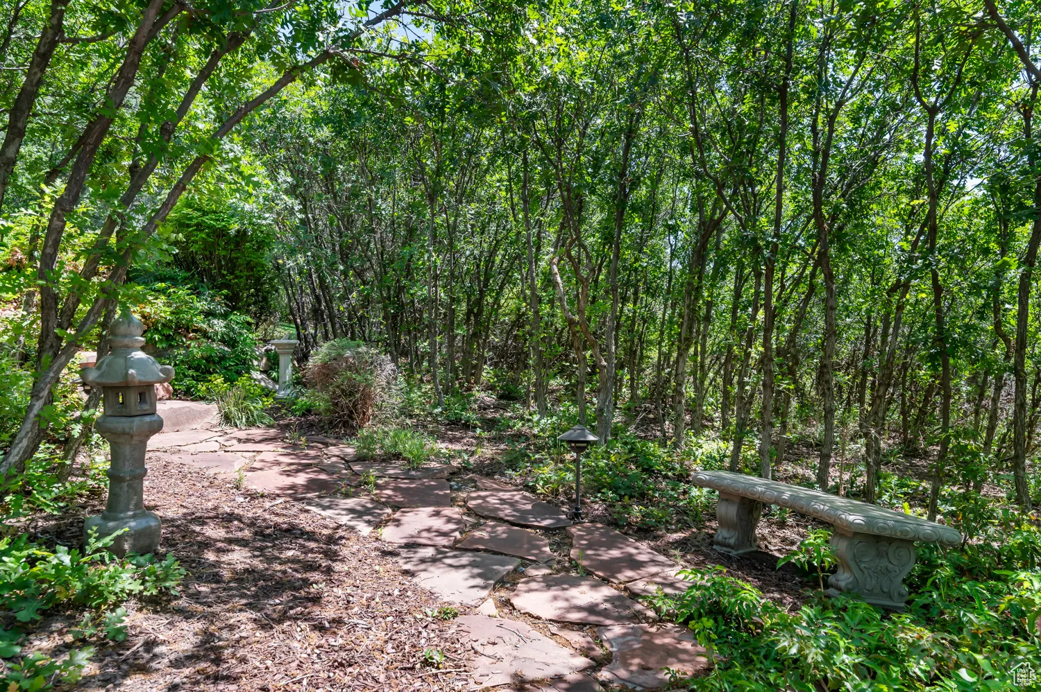 View of community with a wooded view
