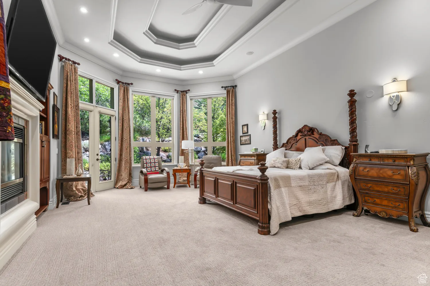 Bedroom featuring light carpet, ornamental molding, and recessed lighting