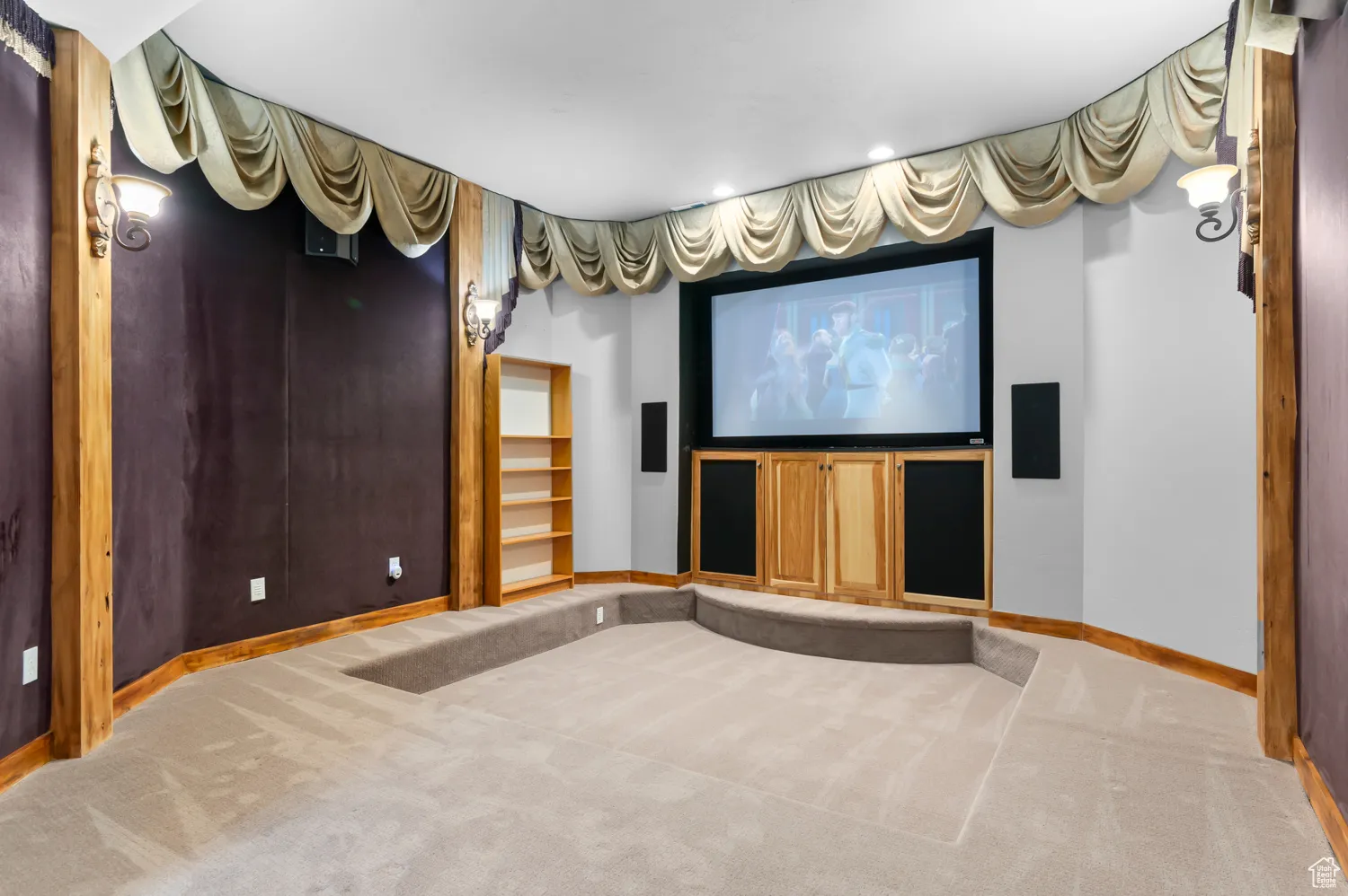 Carpeted cinema room with baseboards and recessed lighting