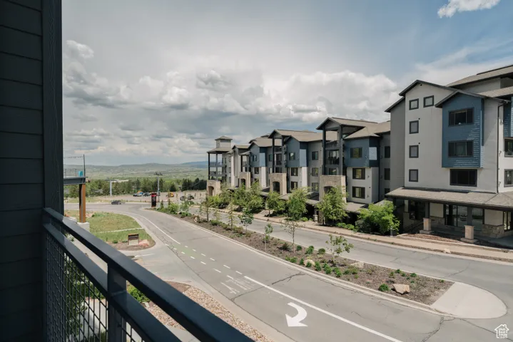 Balcony featuring a mountain view and a residential view