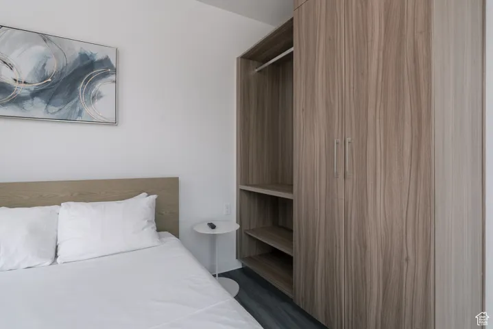 Bedroom with dark wood finished floors