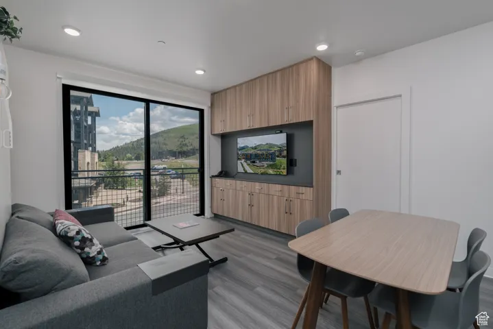Living area featuring wood finished floors and recessed lighting