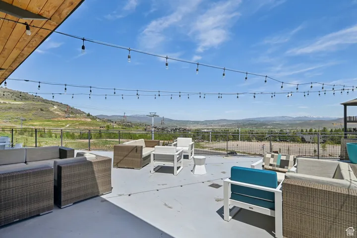 View of patio featuring outdoor lounge area and a mountain view