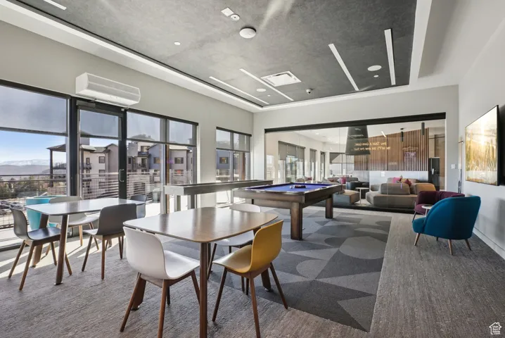 Recreation room featuring billiards, healthy amount of natural light, carpet, and a mountain view