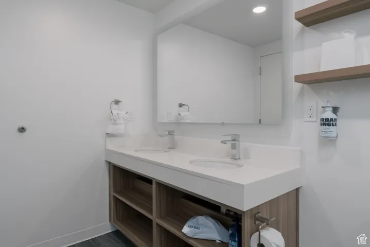Bathroom with double vanity and recessed lighting