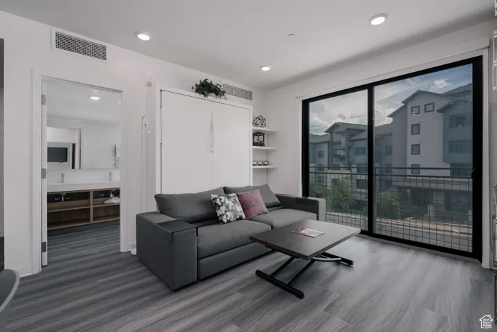 Living room featuring wood finished floors and recessed lighting