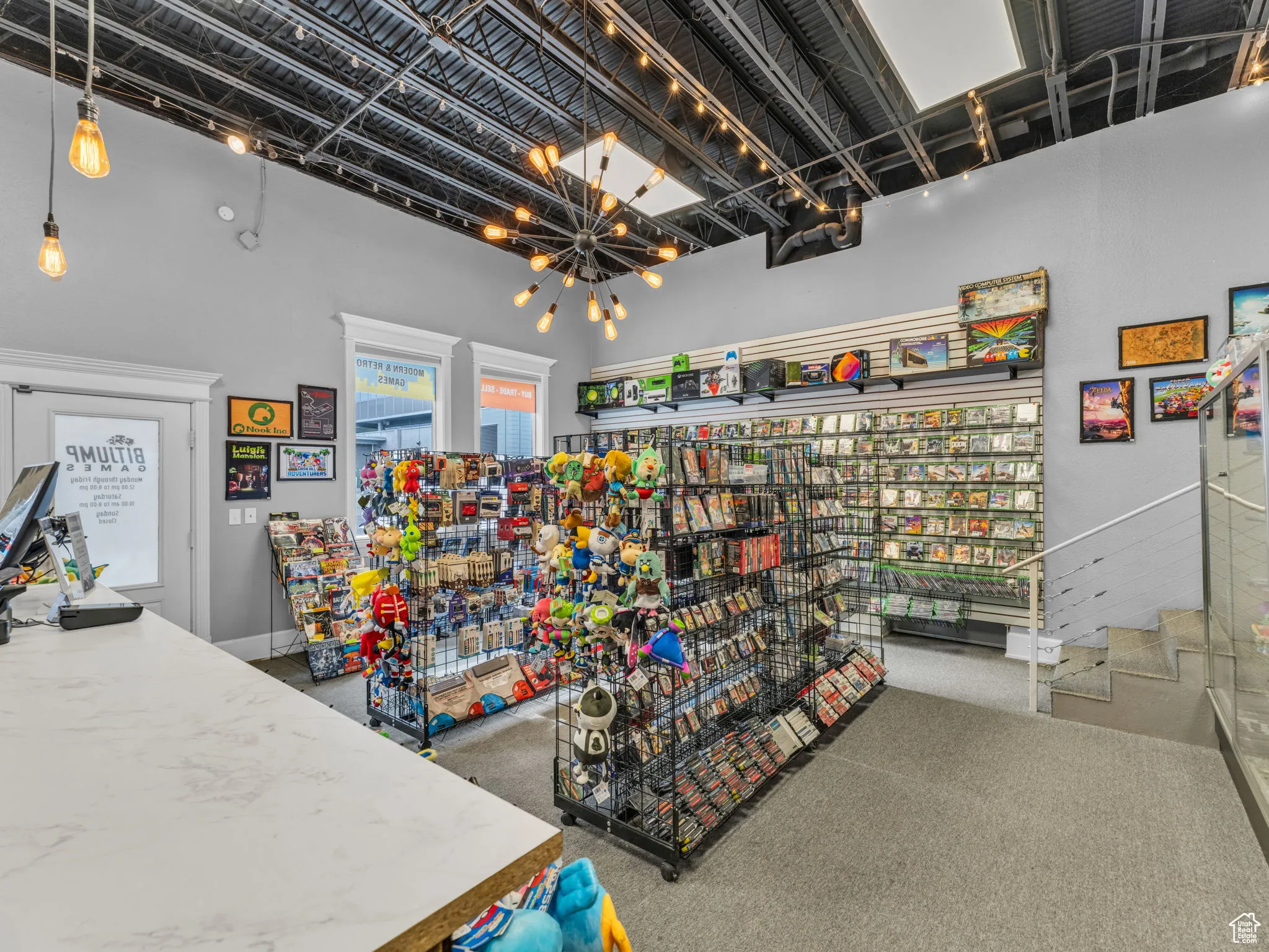 Miscellaneous room featuring carpet and a chandelier