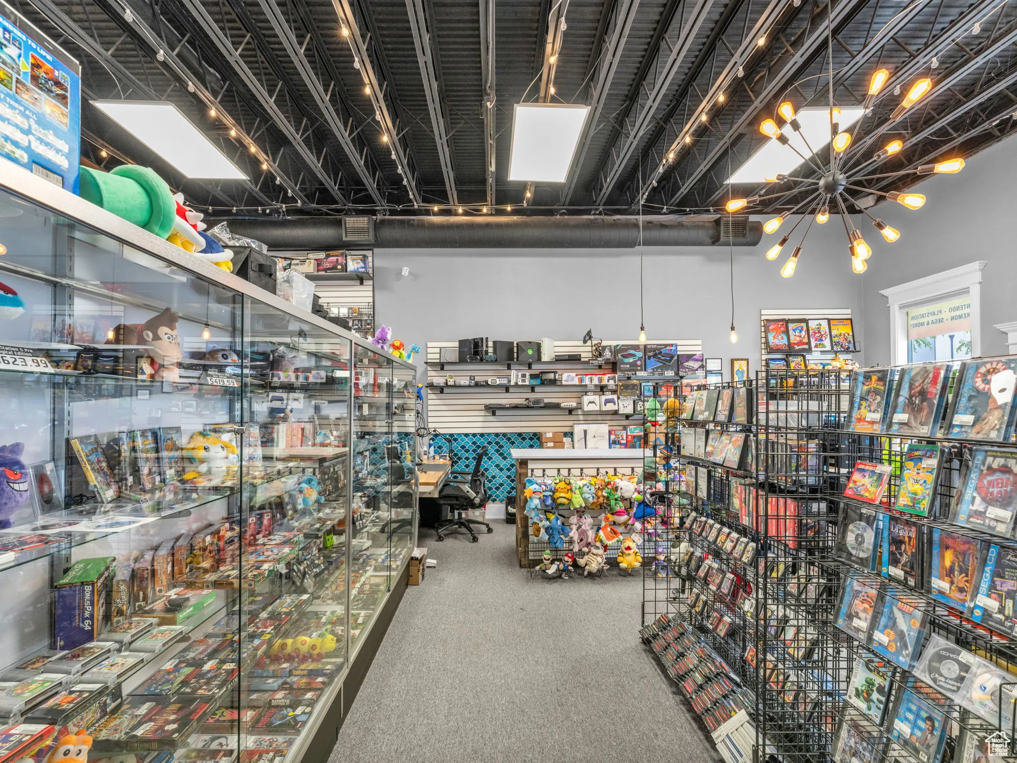 Miscellaneous room featuring a chandelier and carpet floors