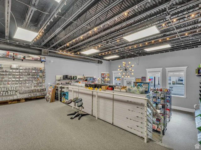 Miscellaneous room featuring carpet flooring and baseboards