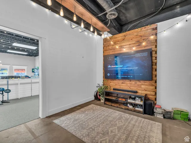 Living room featuring concrete floors