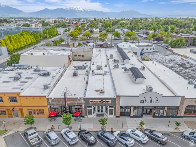 Drone / aerial view of a commercial area and mountains