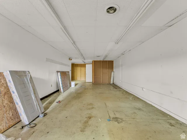 Unfurnished room with baseboards