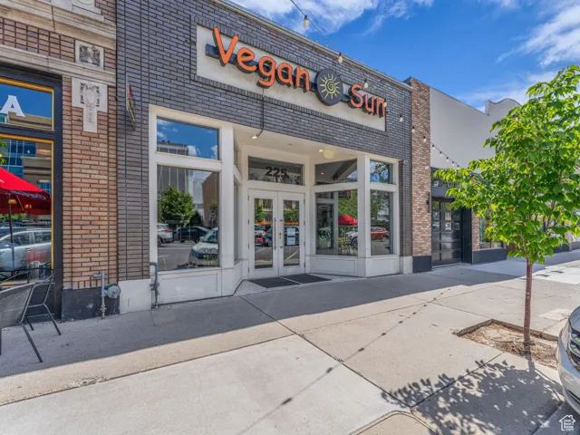 Doorway to property featuring french doors and brick siding