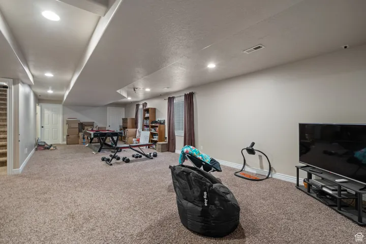Playroom with carpet floors, baseboards, and recessed lighting