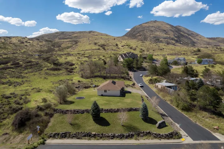 View of subject property featuring a mountain backdrop