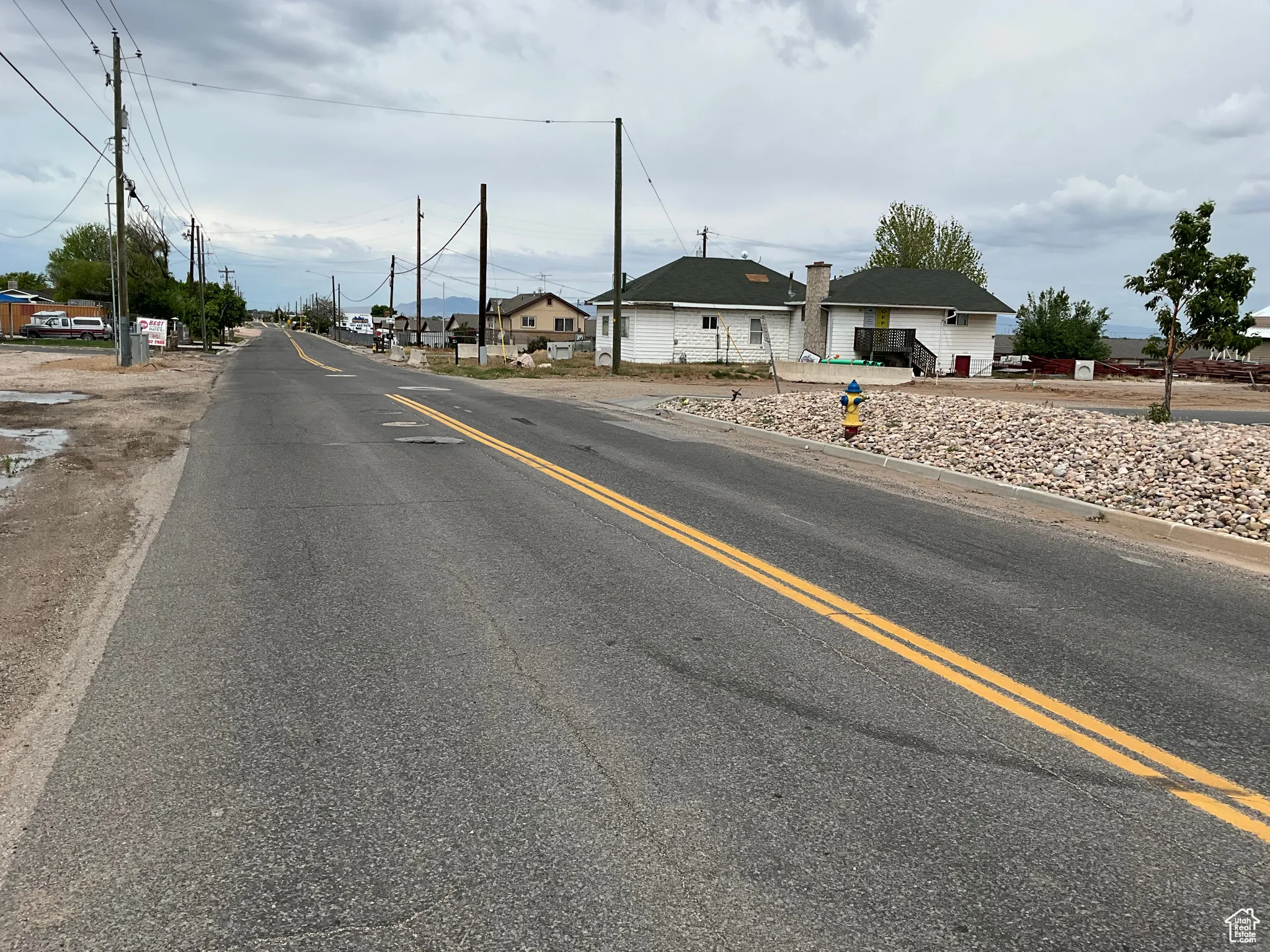 View of asphalt road with a residential view