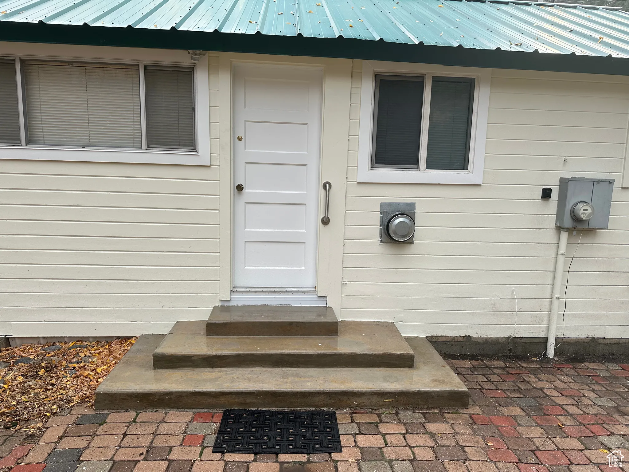 Entrance to property with metal roof