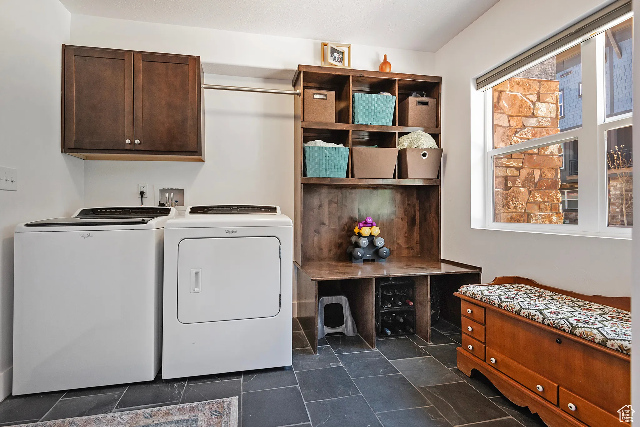 Laundry/mud room with washer and dryer and cabinet space off the Garage