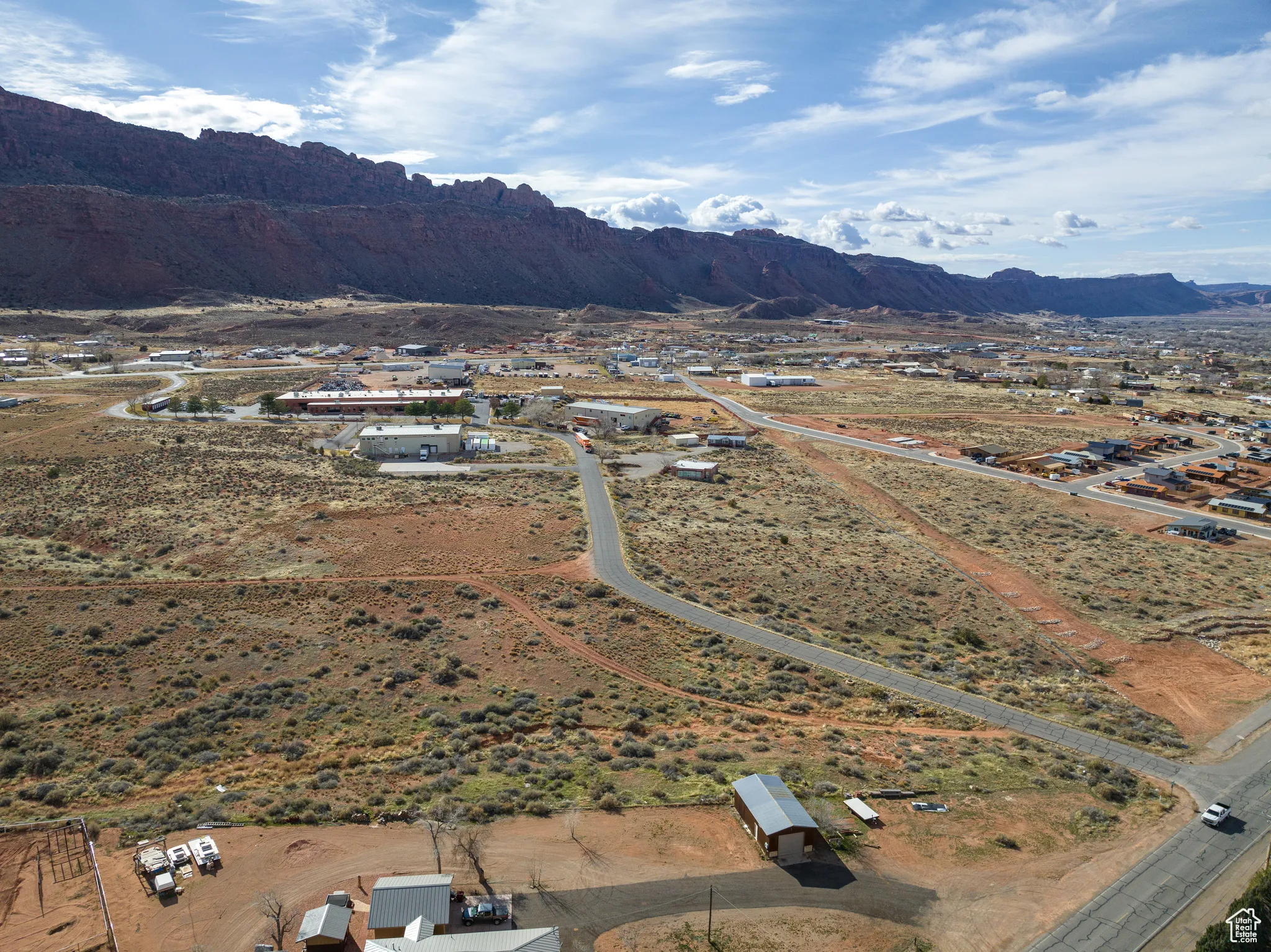 Aerial overview of property's location featuring a mountain backdrop